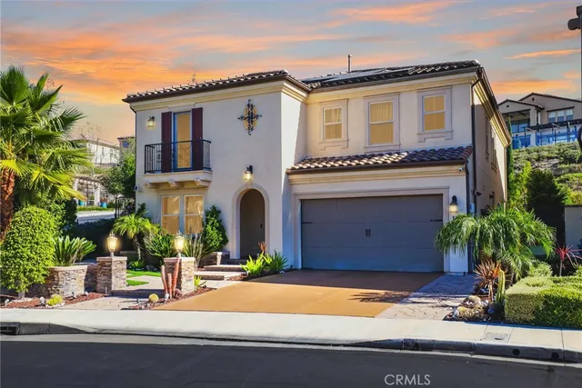 a front view of a house with yard