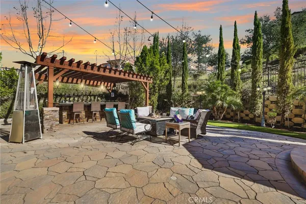a view of swimming pool with outdoor seating
