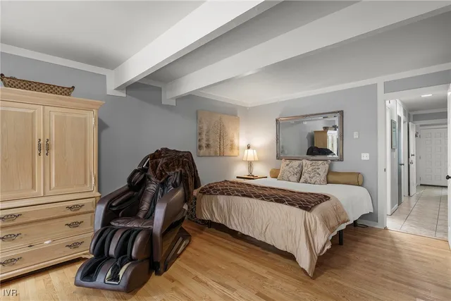 a kitchen with granite countertop a refrigerator stove top oven and sink