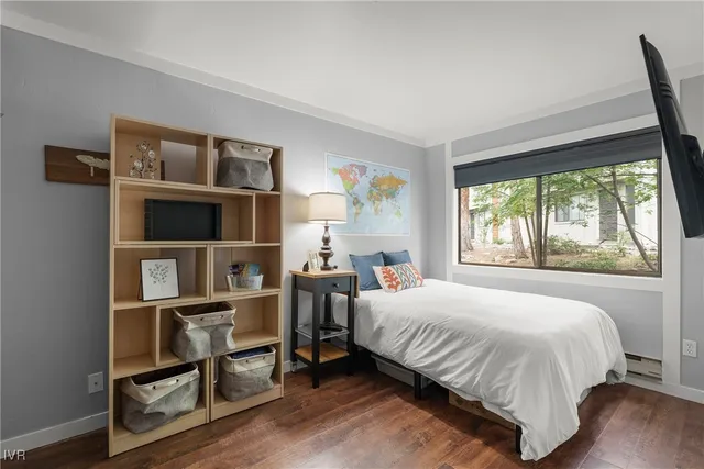 a bathroom with a granite countertop sink a toilet and a mirror