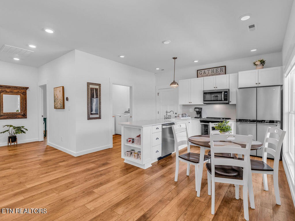 660 Mize Circle Seymour, TN 37865 - Photo 12 of 46 a kitchen with white cabinets and stainless steel appliances
