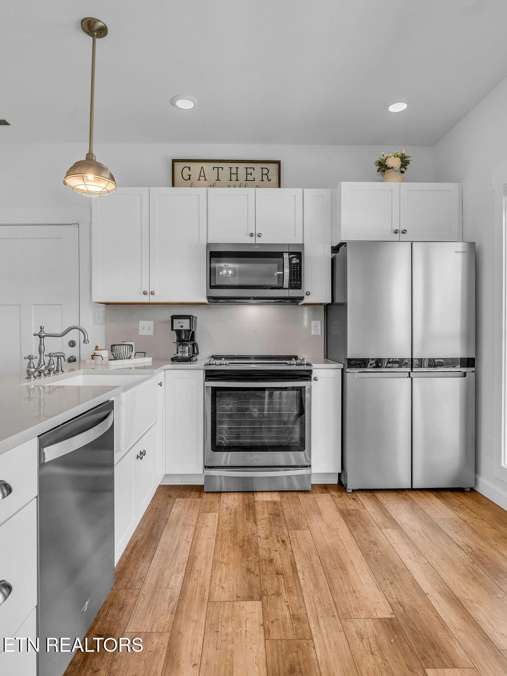 660 Mize Circle Seymour, TN 37865 - Photo 16 of 46 a kitchen with granite countertop a refrigerator and a stove top oven