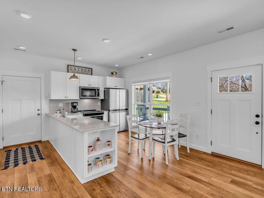 660 Mize Circle Seymour, TN 37865 - Photo 18 of 46 a kitchen with stainless steel appliances a stove a sink and a refrigerator