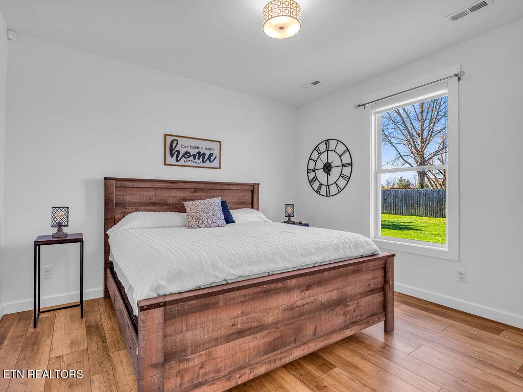 660 Mize Circle Seymour, TN 37865 - Photo 22 of 46 a bedroom with a bed and a painting on the wall