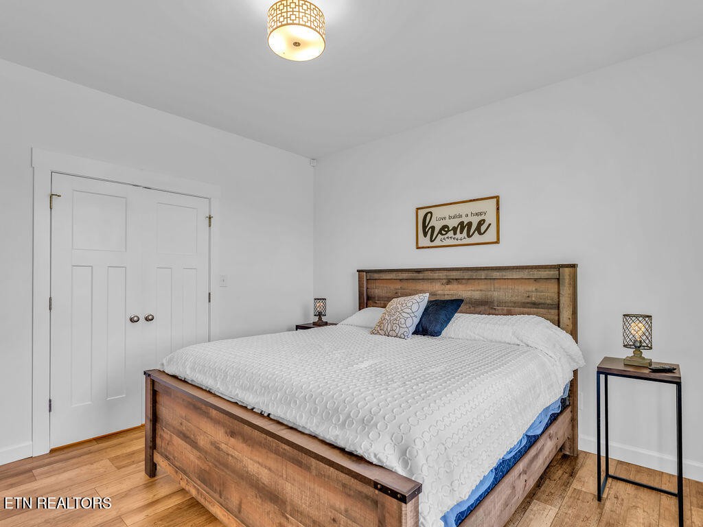 660 Mize Circle Seymour, TN 37865 - Photo 24 of 46 a bedroom with a bed and a potted plant