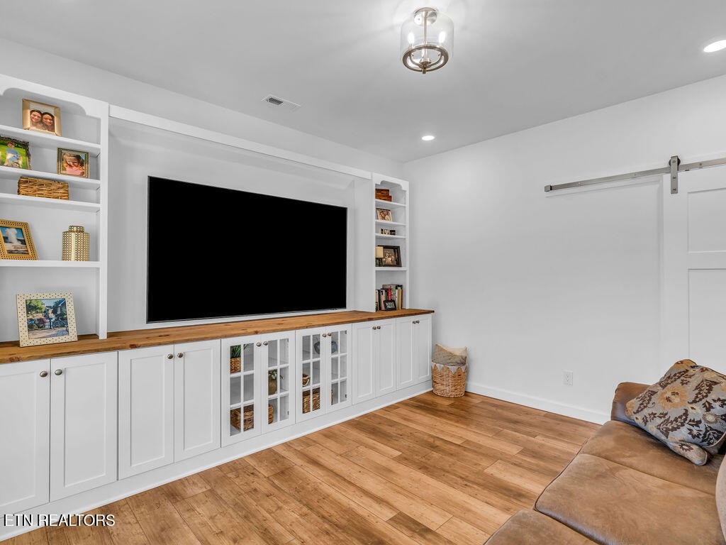 660 Mize Circle Seymour, TN 37865 - Photo 8 of 46 a bedroom with furniture and flat screen tv