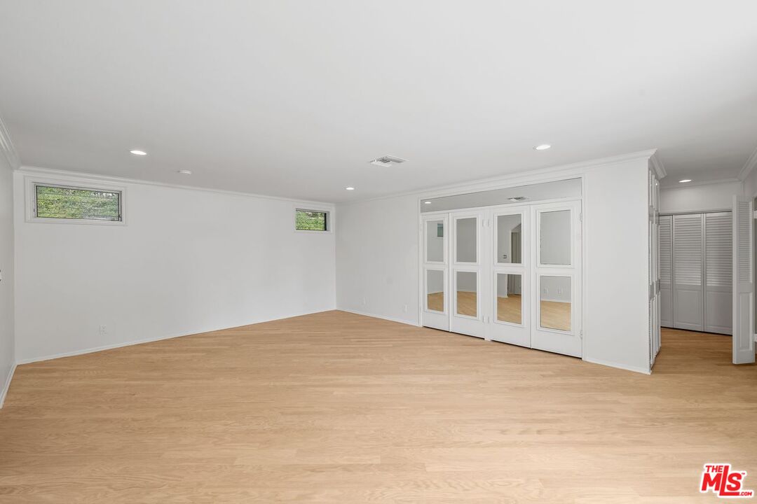 1700 Rising Glen Road Los Angeles, CA 90069 - Photo 11 of 19 a view of an empty room with a window