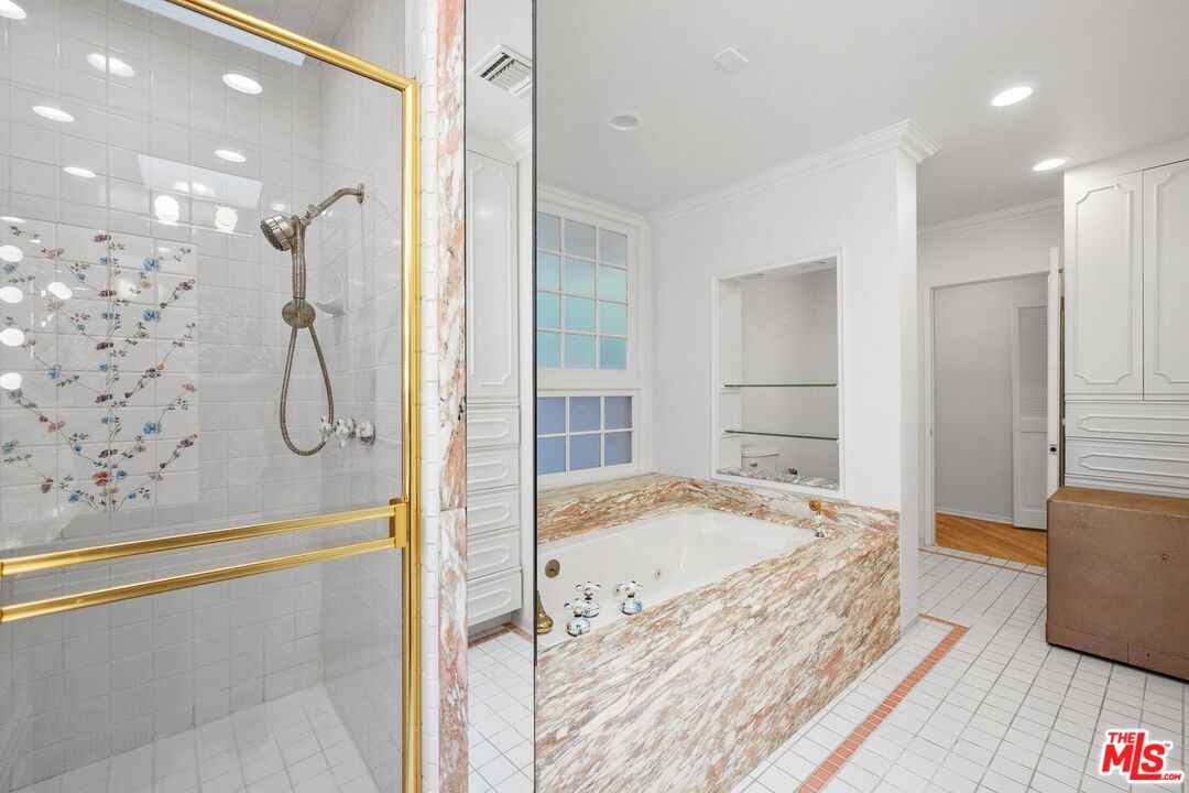 1700 Rising Glen Road Los Angeles, CA 90069 - Photo 12 of 19 a bathroom with a granite countertop sink a mirror and shower