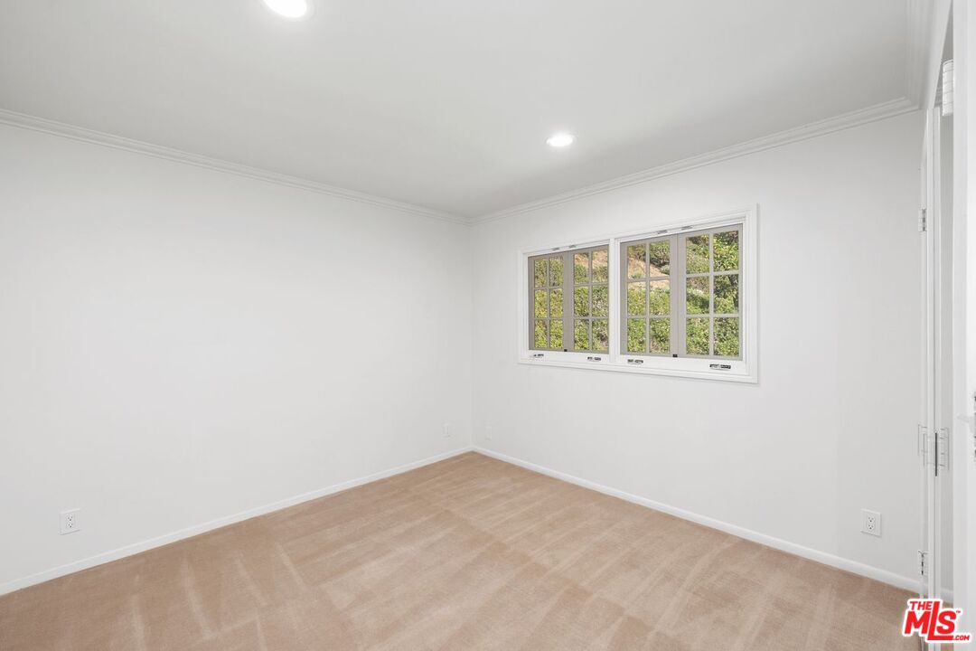 1700 Rising Glen Road Los Angeles, CA 90069 - Photo 13 of 19 an empty room with a window