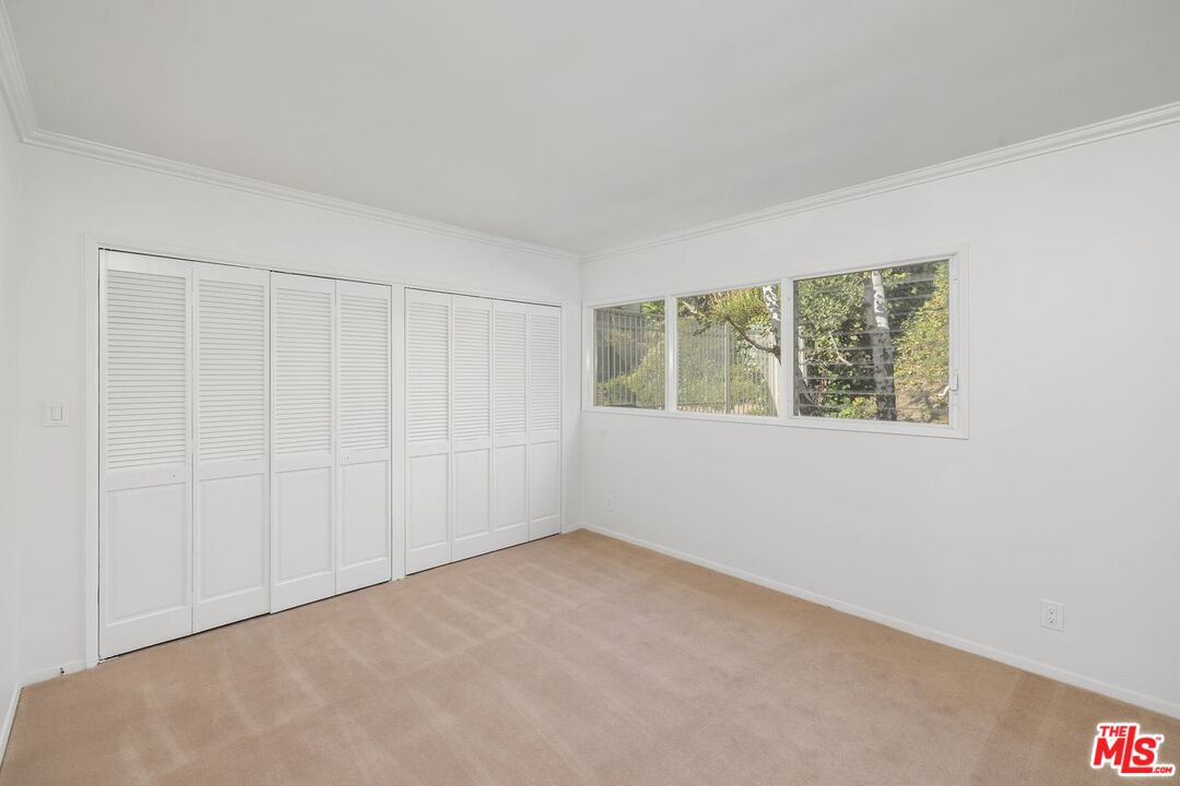 1700 Rising Glen Road Los Angeles, CA 90069 - Photo 14 of 19 an empty room with a window