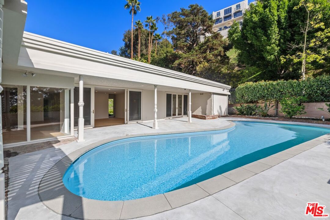 1700 Rising Glen Road Los Angeles, CA 90069 - Photo 16 of 19 a view of house with yard outdoor seating and entertaining space
