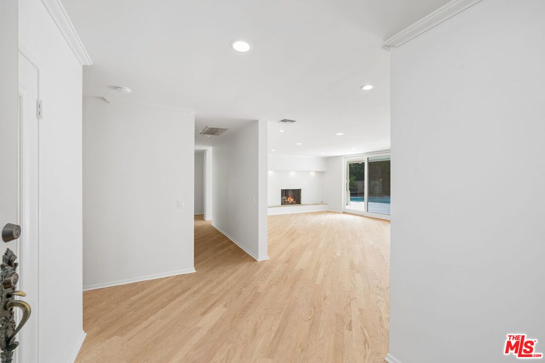 1700 Rising Glen Road Los Angeles, CA 90069 - Photo 3 of 19 a view of an empty room and wooden floor