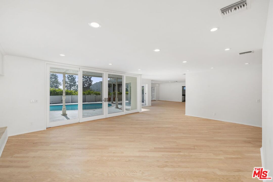 1700 Rising Glen Road Los Angeles, CA 90069 - Photo 5 of 19 a view of an empty room with a window