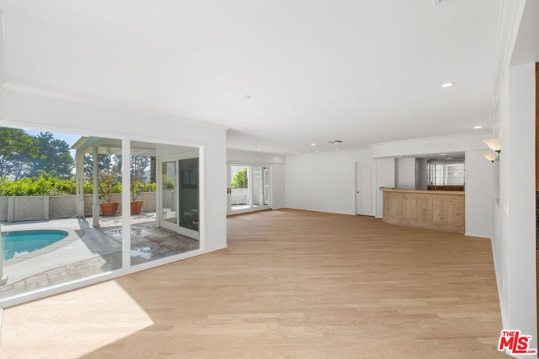 1700 Rising Glen Road Los Angeles, CA 90069 - Photo 7 of 19 a view of an empty room with a kitchen
