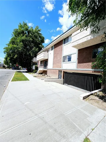 a view of backyard with a patio