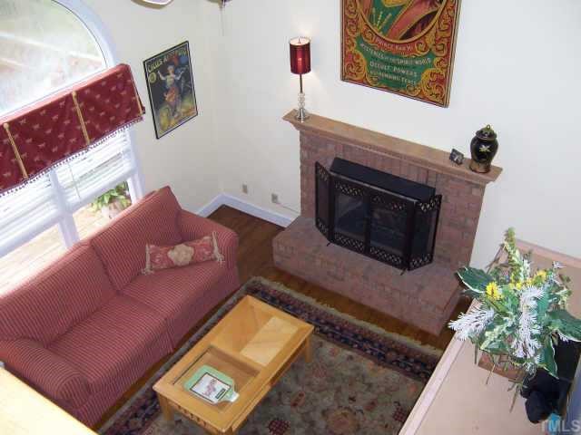 2500 Diamondhitch Trail Raleigh, NC 27615 - Photo 6 of 10 Vaulted ceiling in family room with palladium style window.