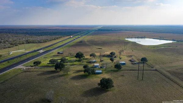 a view of a yard with swimming pool