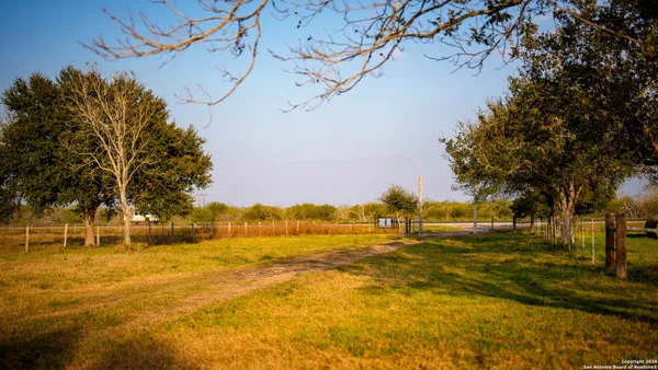 a view of a lake with a yard