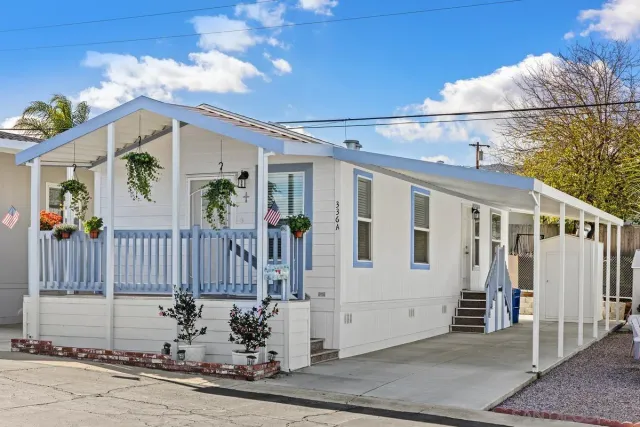 a view of a house with a small yard