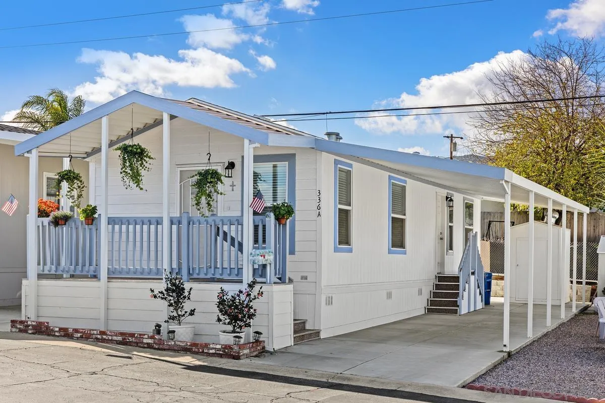 a view of a house with a small yard