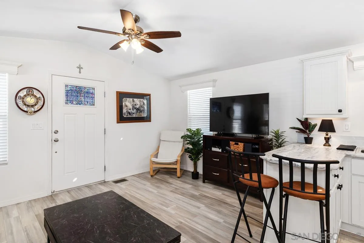 8545 Mission Gorge Road, Unit SPC 336A Santee, CA 92071 - Photo 11 of 28 a living room with furniture and a flat screen tv