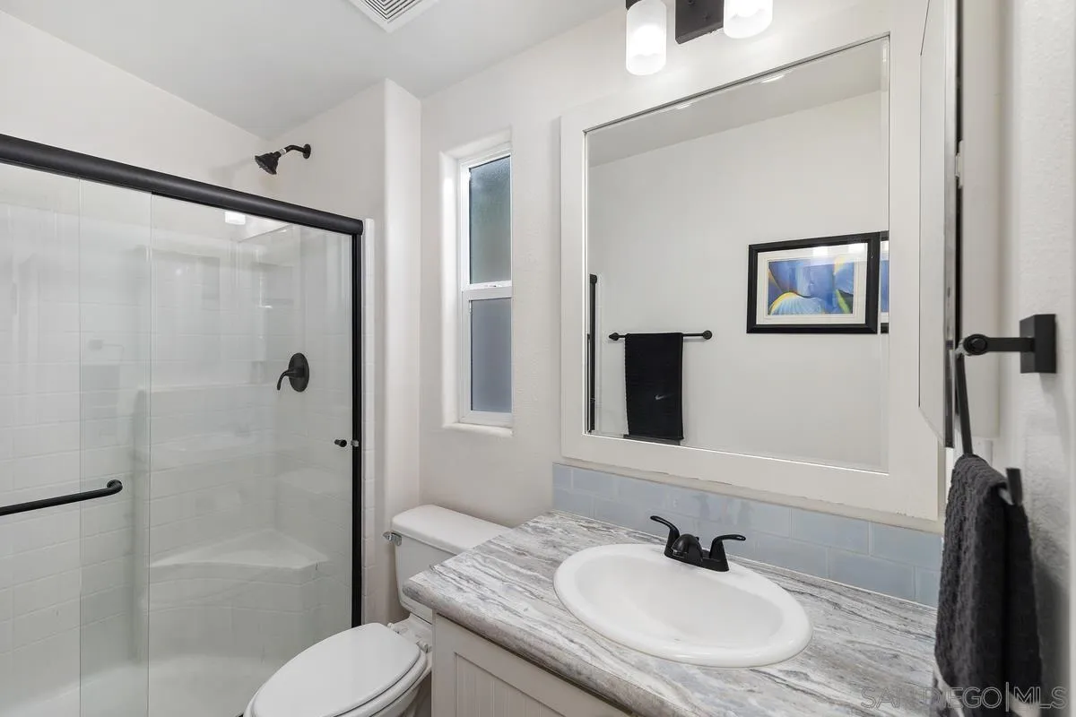 8545 Mission Gorge Road, Unit SPC 336A Santee, CA 92071 - Photo 19 of 28 a bathroom with a granite countertop sink toilet and shower