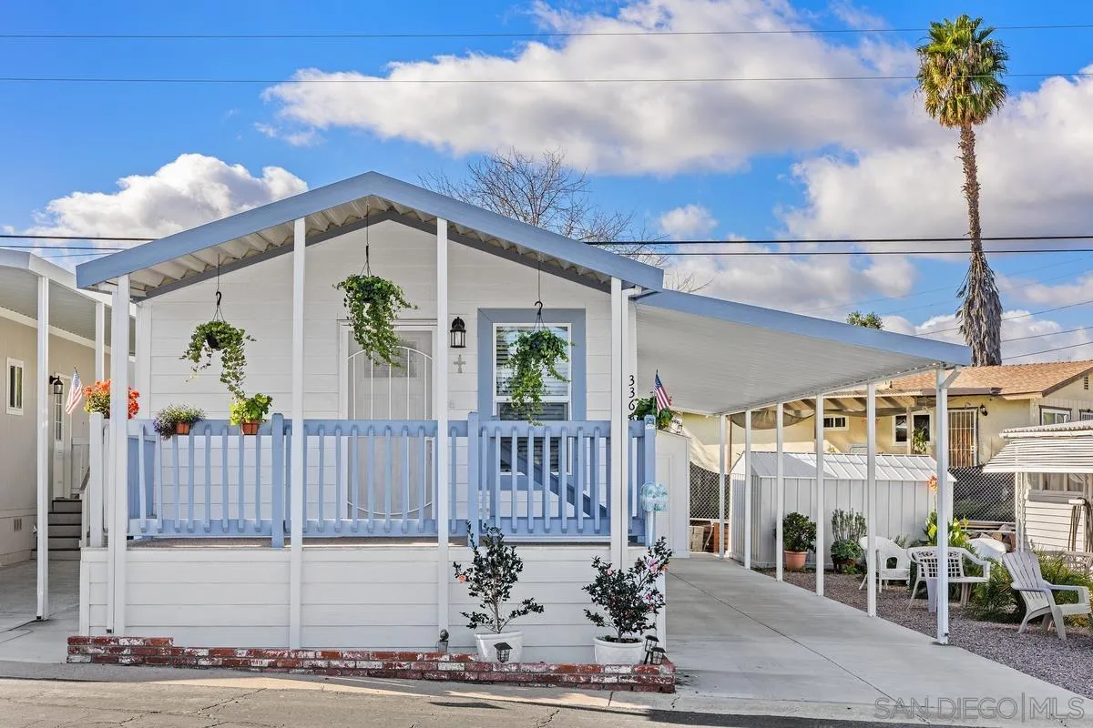 8545 Mission Gorge Road, Unit SPC 336A Santee, CA 92071 - Photo 2 of 28 a view of a house with wooden fence