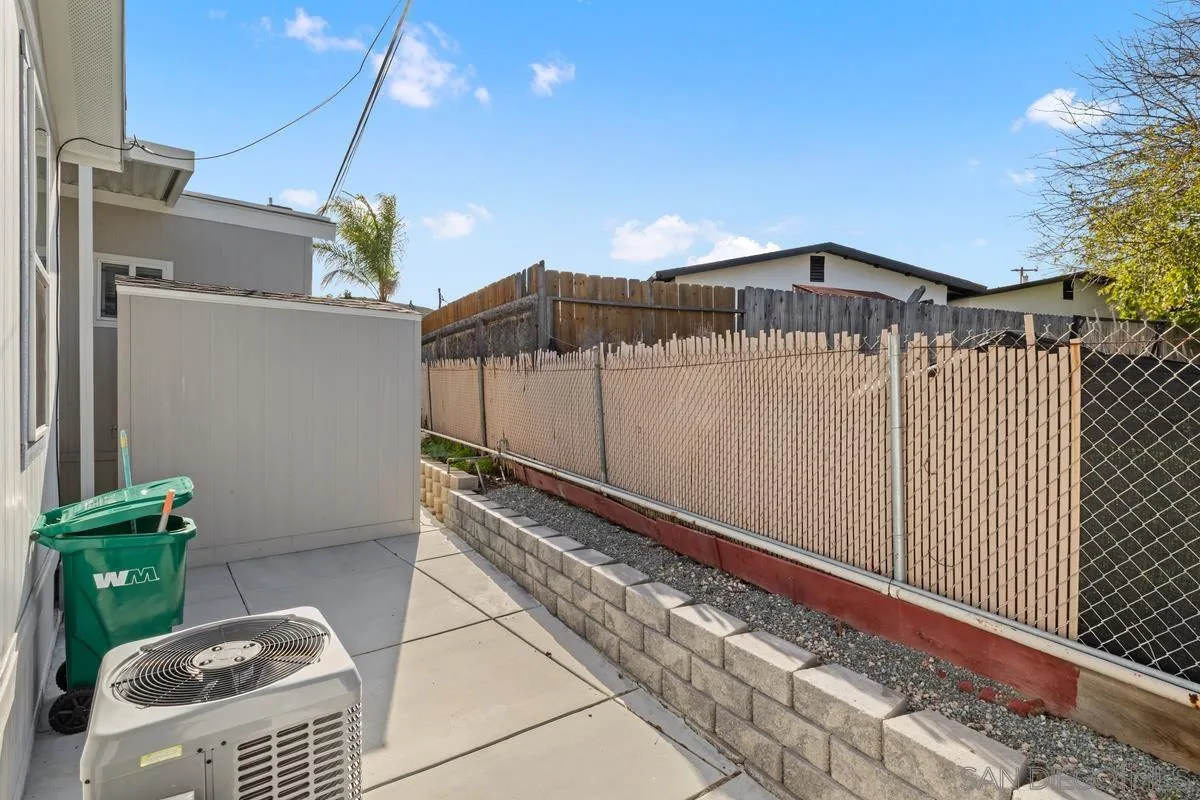 8545 Mission Gorge Road, Unit SPC 336A Santee, CA 92071 - Photo 22 of 28 a front view of a house with a yard
