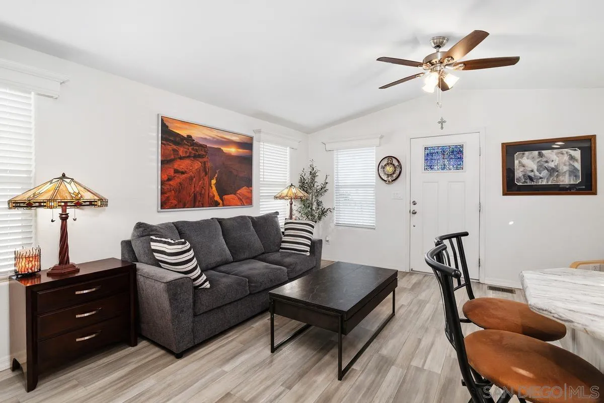 8545 Mission Gorge Road, Unit SPC 336A Santee, CA 92071 - Photo 9 of 28 a living room with furniture and a lamp