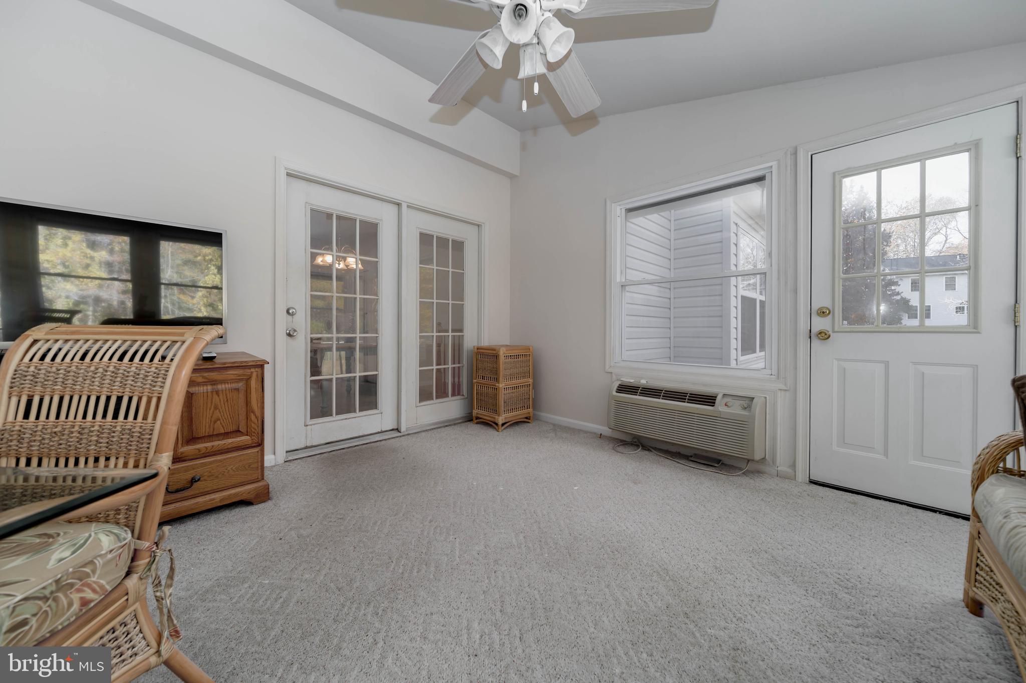 620 Small Reward Road Huntingtown, MD 20639 - Photo 12 of 33 a spacious bedroom with a bed and a chandelier