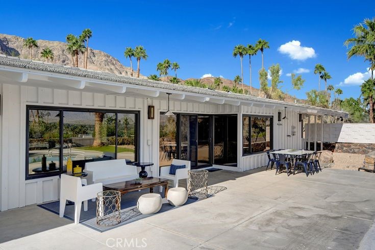 40600 Tonopah Road Rancho Mirage, CA 92270 - Photo 11 of 28 a view of a patio with dining table and chairs with plants