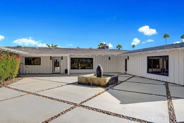 a front view of a house with a patio