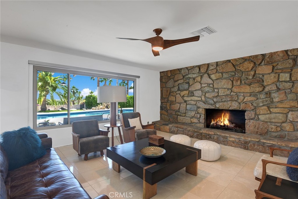 40600 Tonopah Road Rancho Mirage, CA 92270 - Photo 18 of 28 a living room with furniture and a fireplace