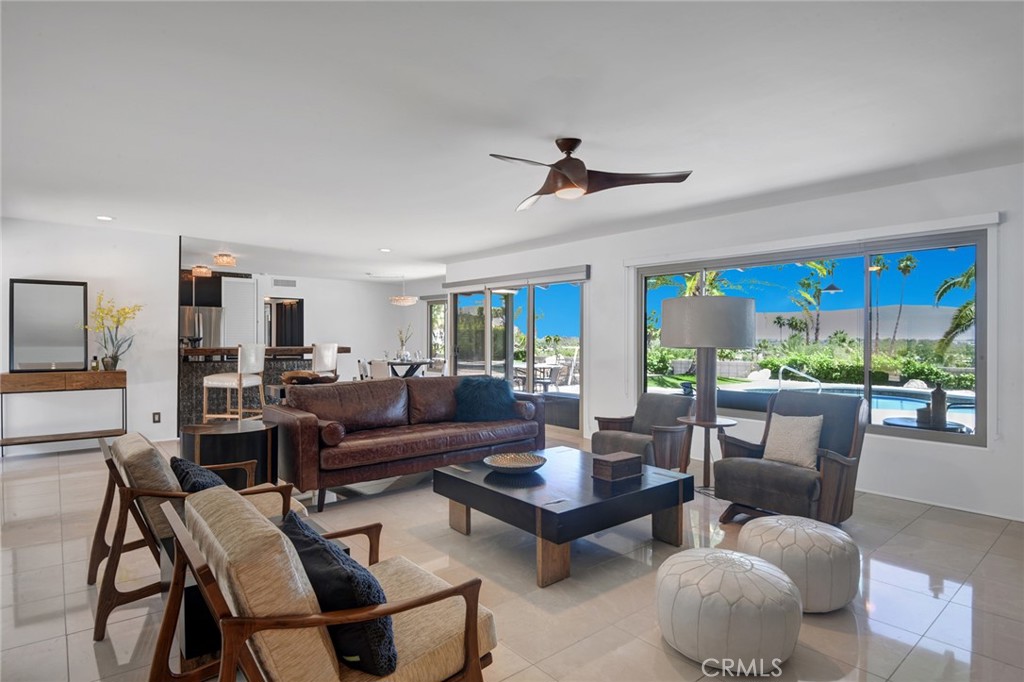 40600 Tonopah Road Rancho Mirage, CA 92270 - Photo 21 of 27 a living room with furniture ceiling fan and a large window