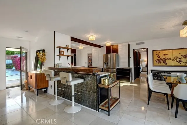 a room with lots of furniture and windows