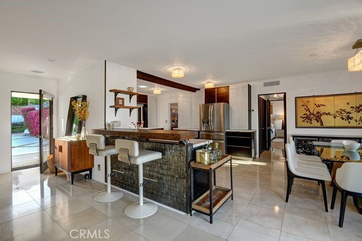 40600 Tonopah Road Rancho Mirage, CA 92270 - Photo 24 of 27 a room with lots of furniture and windows