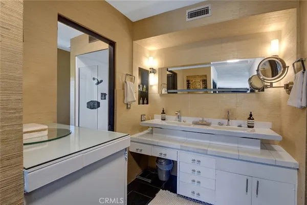 a bathroom with a sink and a mirror