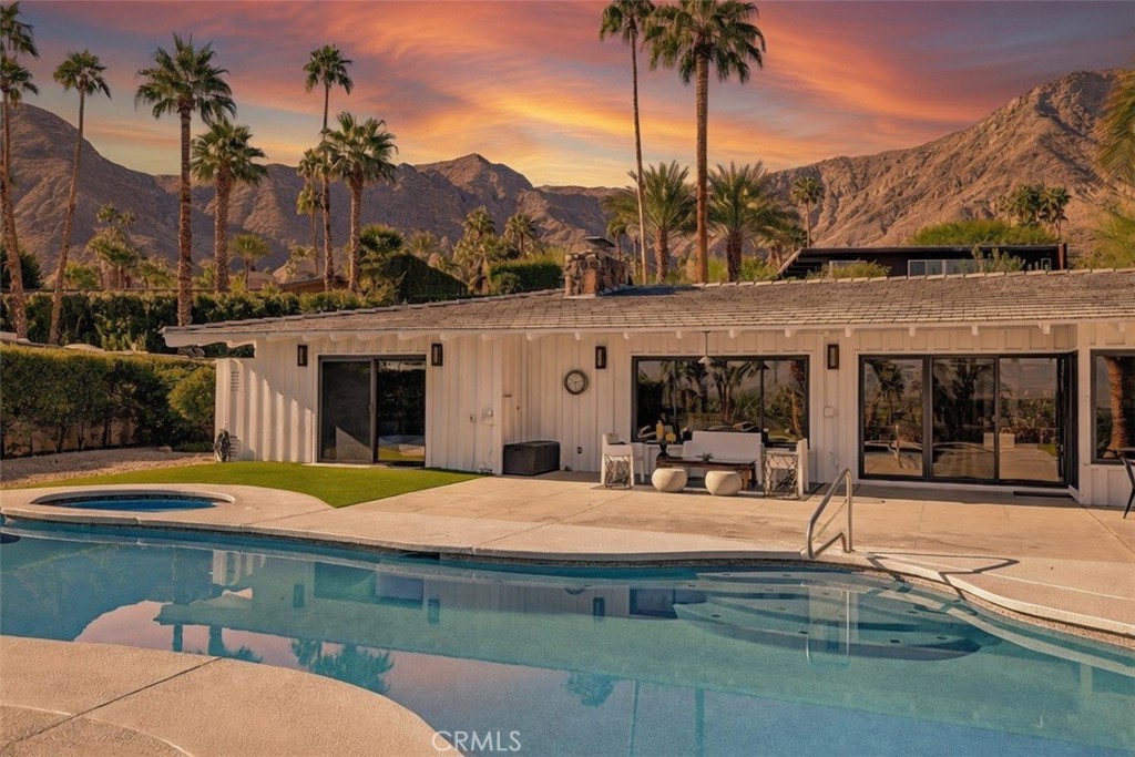 40600 Tonopah Road Rancho Mirage, CA 92270 - Photo 3 of 28 a swimming pool with outdoor seating and yard