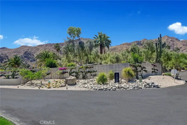 a view of a street with a building in the background