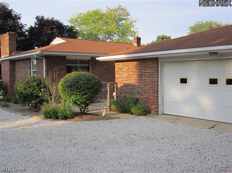 3206 Grill Road Clinton, OH 44216 - Photo 3 of 24 oversized 2 car garage with storage space Patio area