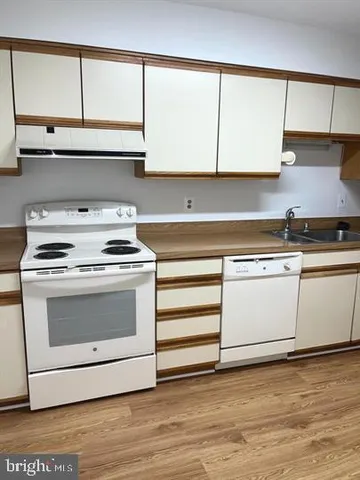 an empty room with wooden floor