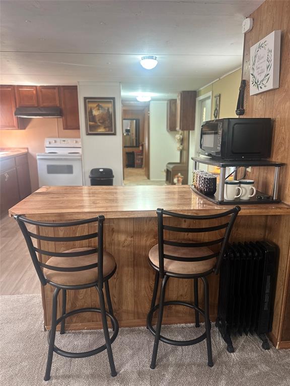 142 Lonely Pine Road Waco, TX 76708 - Photo 11 of 31 a room with a table chairs and a flat screen tv