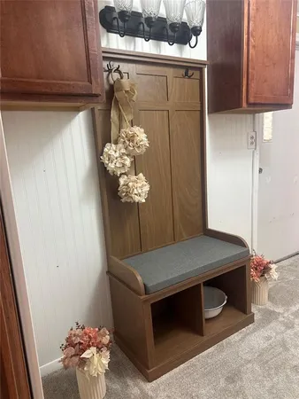 a white toilet sitting next to a small bathroom