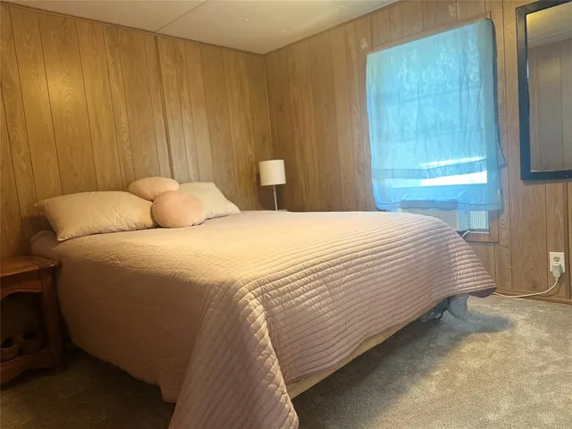 a view of kitchen with furniture and windows
