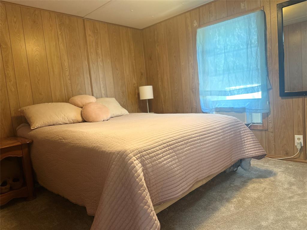 142 Lonely Pine Road Waco, TX 76708 - Photo 19 of 31 a bedroom with a bed and a window