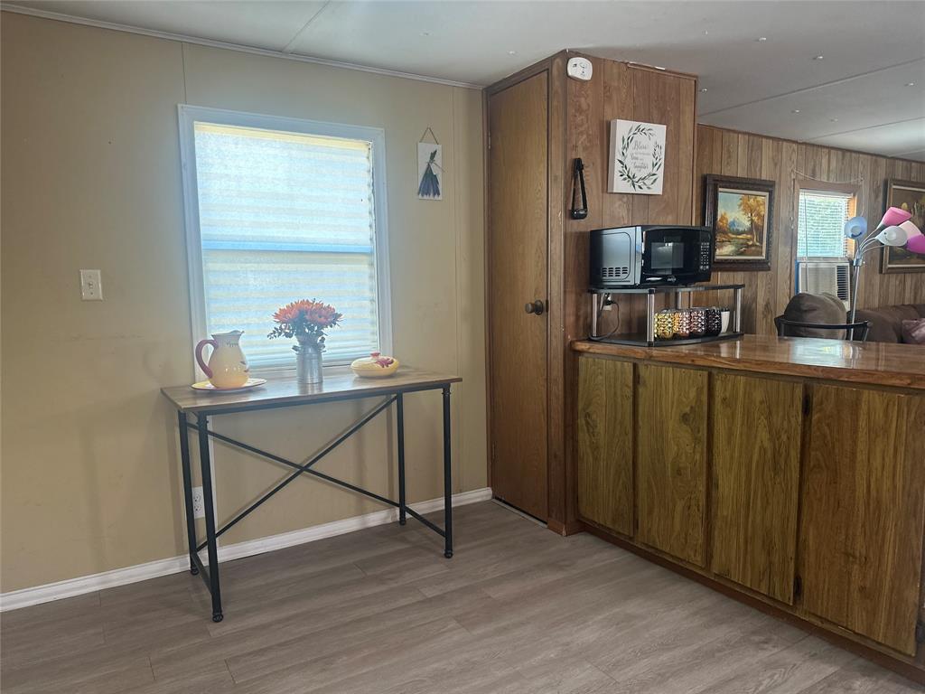 142 Lonely Pine Road Waco, TX 76708 - Photo 2 of 31 a view of room with window and wooden floor