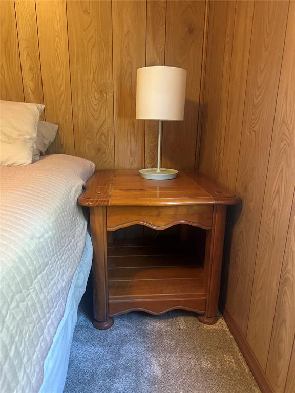 142 Lonely Pine Road Waco, TX 76708 - Photo 21 of 31 a bedroom with a bed and a table