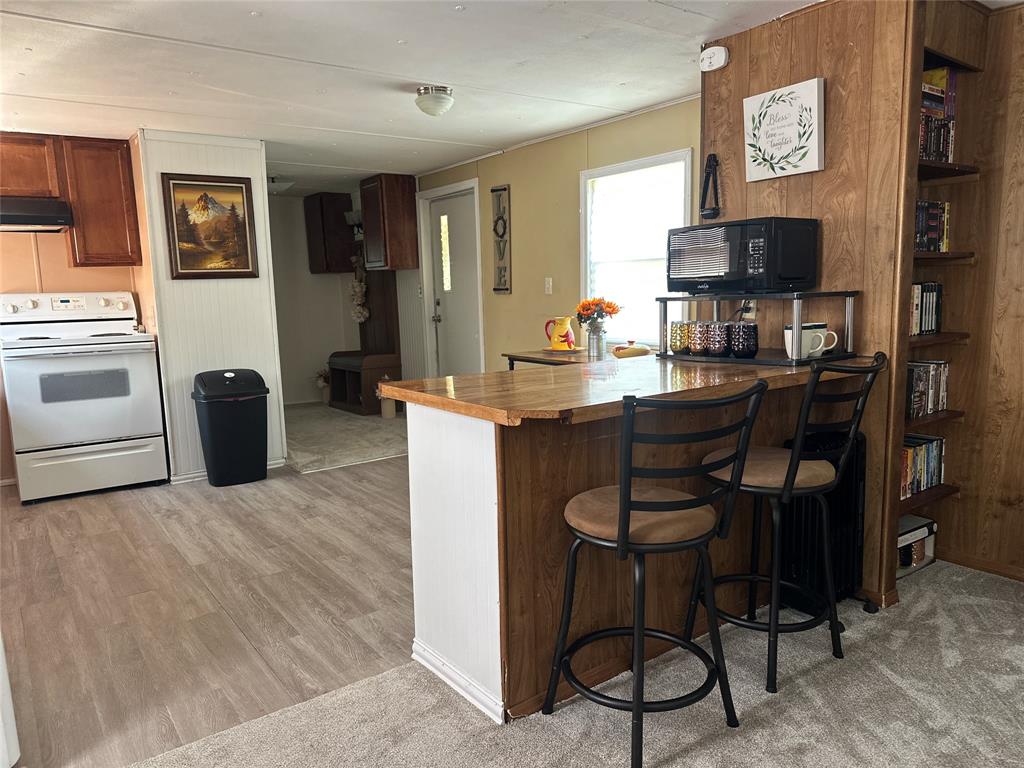 142 Lonely Pine Road Waco, TX 76708 - Photo 3 of 31 a view of a dining room with furniture and wooden floor