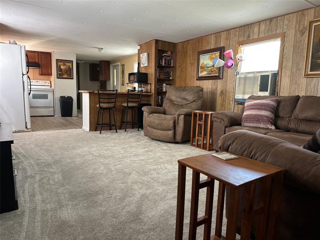 142 Lonely Pine Road Waco, TX 76708 - Photo 7 of 31 a living room with furniture and a flat screen tv