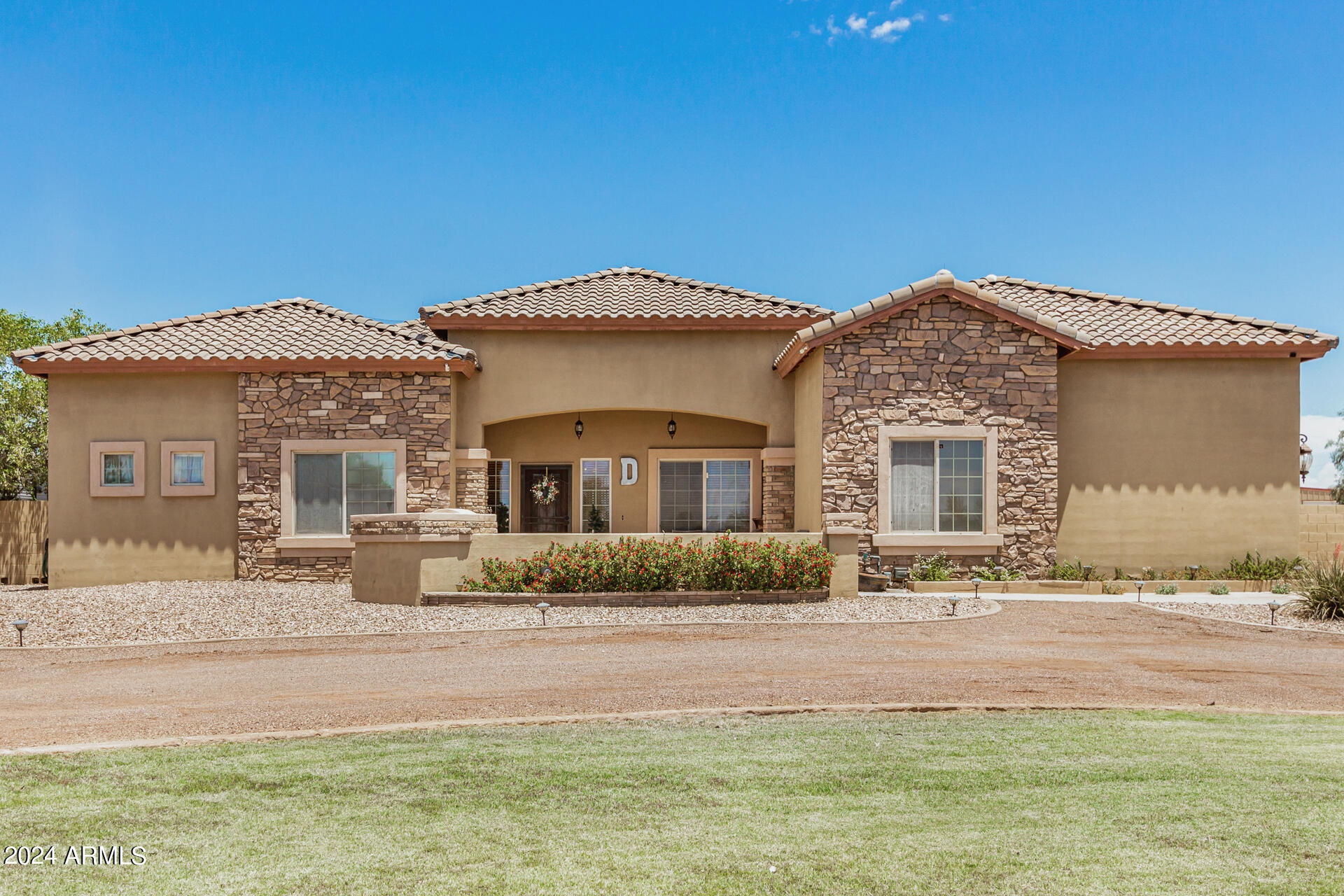 20716 West Telegram Path Road Buckeye, AZ 85326 - Photo 1 of 65 a front view of a house with a yard